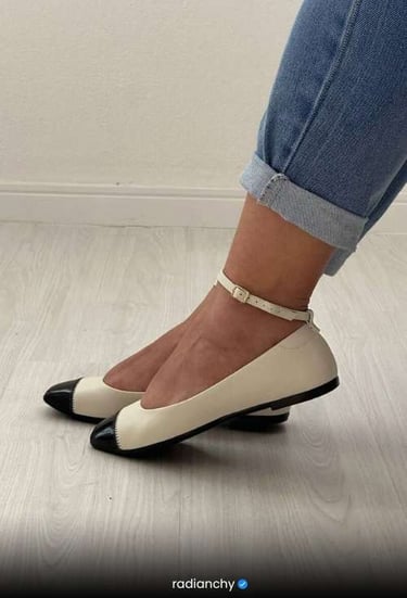 a woman's feet in jeans and heels