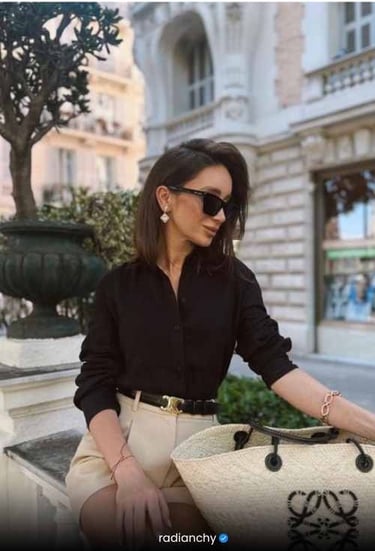 a woman in a black shirt and white shorts