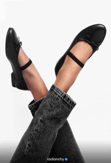 a woman's legs and feet in jeans and heels