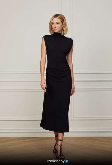 a woman in a black dress and sandals