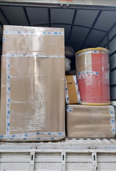 ''furniture being loaded into a truck, which is securely wrapped.'' 