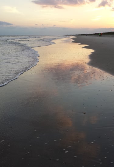 a walkalong a beach at sunset