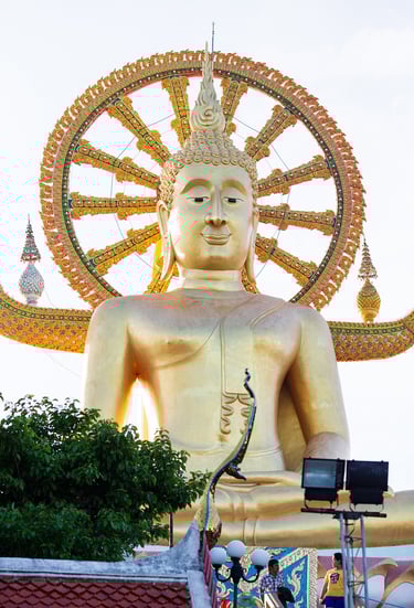 A close-up of the iconic Big Buddha statue on Koh Samui, Thailand. The golden Buddha