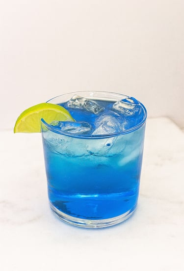 Blue Waters mocktail with citrus garnish served at professional mobile bar service