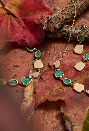 Jewellery product photography - a necklace with a green stones