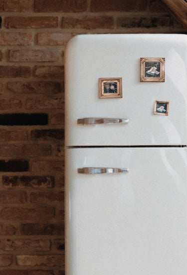 a fridge with tiny painted magnets