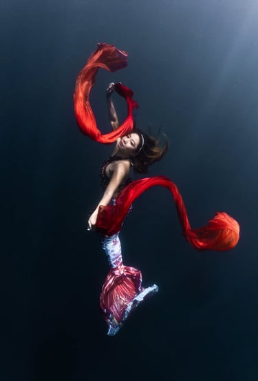 Amarie in a spectacular underwater shot with silk veils in the ocean