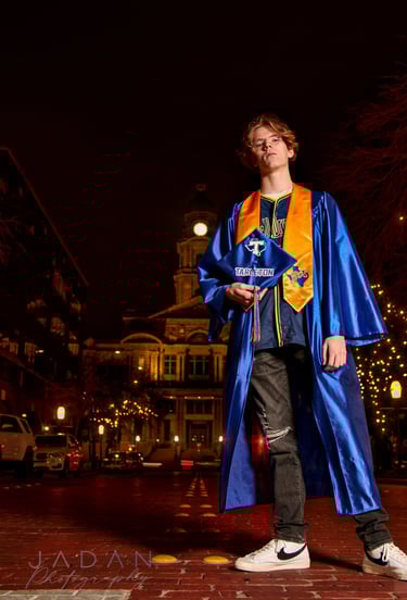 high school senior photo shot at night in downtown fort worth of the dfw metroplex