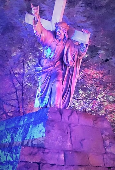 Portland, OR - Lifesize statue of Jesus holding the cross, lit up for Christmas