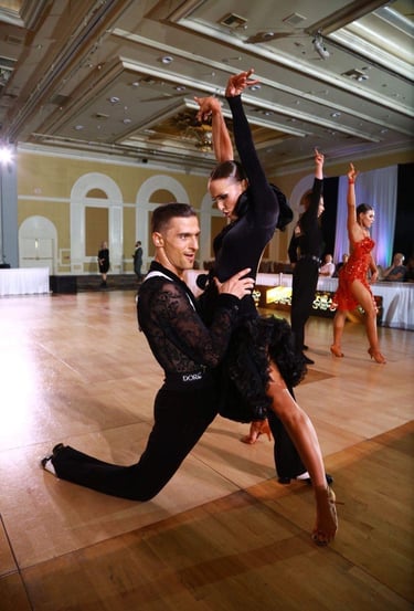 a man surprised  and holding a women in split postion