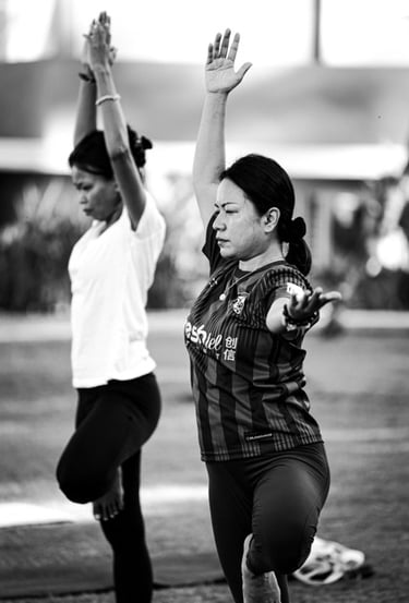 Students practice the Tree Pose in a yoga class in Langkawi