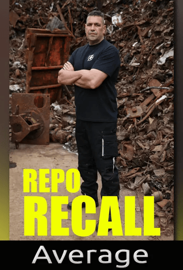 A man standing in front of scrap metal 