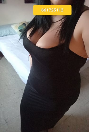 a woman in a black dress with a yellow tag on her chest