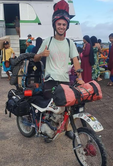 a man in a helmet and helmet on a motorcycle