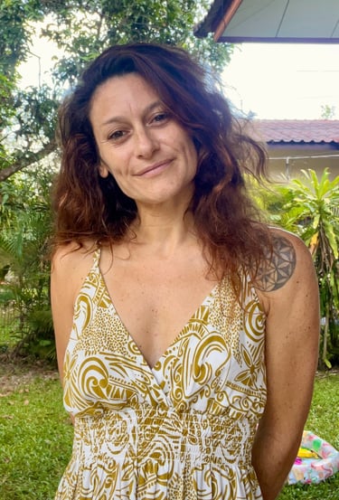 a woman with a tattoo on her chest and a tattoo on her chest