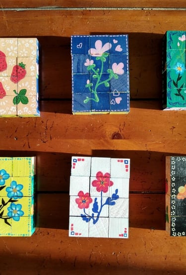 Handpainted wooden six-picture block puzzles with traditional folk art flower designs
