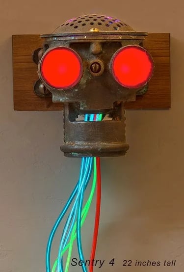 Assemblage robot head built by artist Tal Avitzur from fishing boat pump.