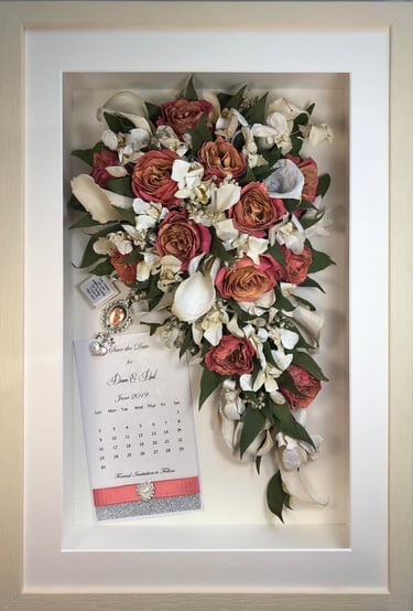 trailing view preserved wedding bouquet with keepsakes in a frame