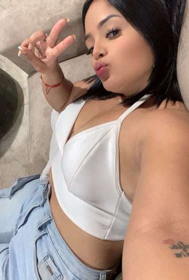 a woman with a white bra top and jeans