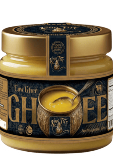 A glass jar of premium King Tut Cow Ghee with a gold lid and elegant vintage-style label.