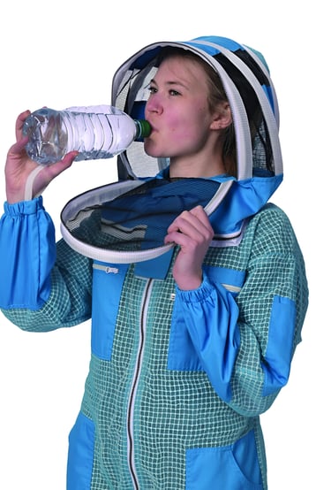 a woman in a bee suit drinking water from a bottle