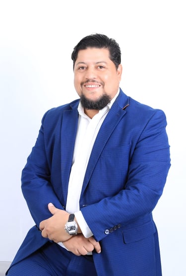 a man in a blue suit and white shirt