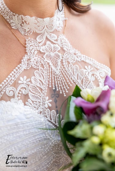 a woman in a wedding dress with a bouquet