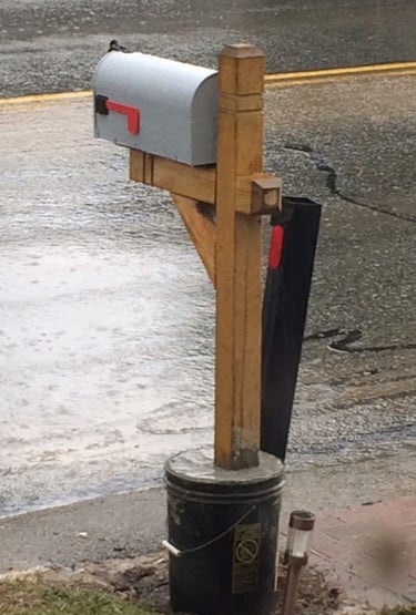 Temporary mailbox with wooden post