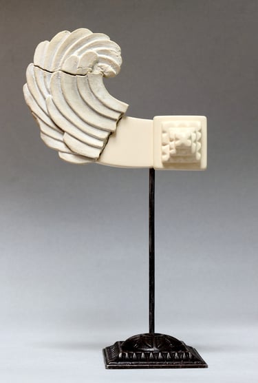 Very small ceramic sculpture variation of fragmented, reconstructed Greek Archaic-style wing.
