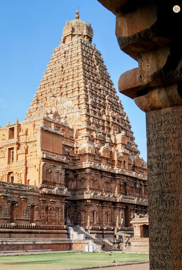 View of the Big Temple through carved pillars with ancient Tamil writing