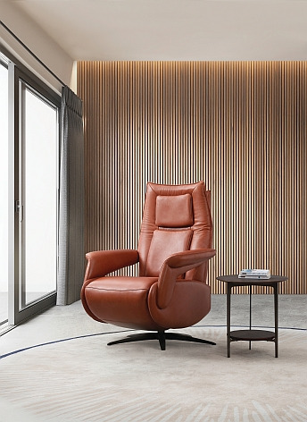 a chair with a table and a table with a glass of wine