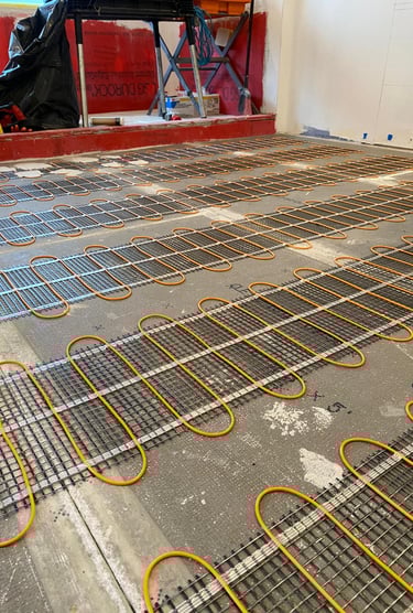 Electric heated bathroom floor installation in Winnetka, IL with new tile and modern fixtures