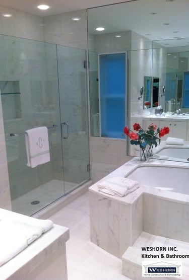 Luxury Glenview master bath featuring big soaking tub wall mirror, and glass walk-in shower