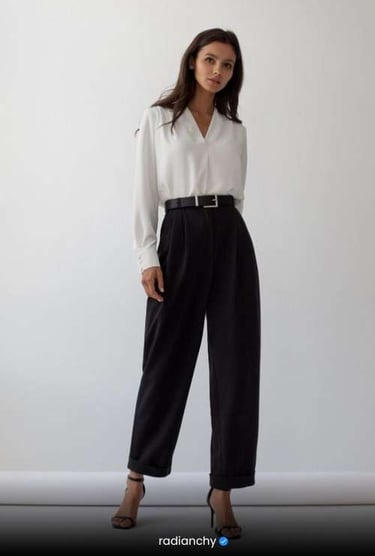 a woman in a white shirt and black pants