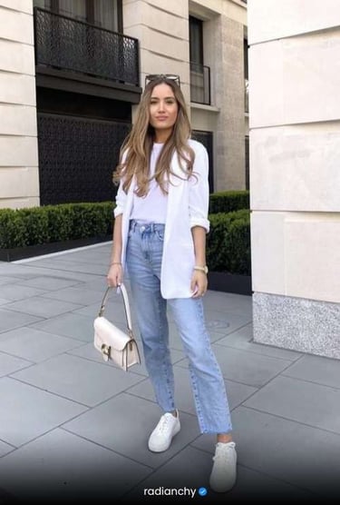a woman in jeans and a white shirt