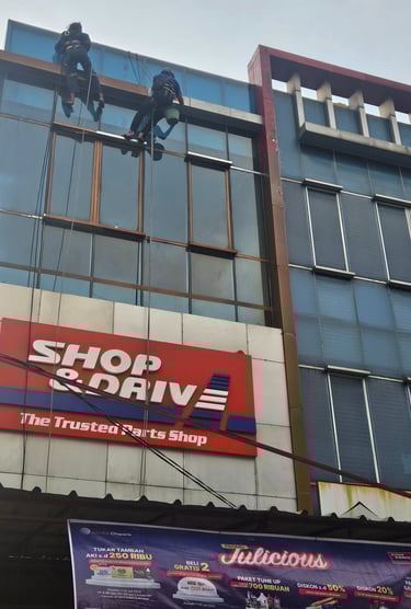 a man on a rope rope in front of a shop