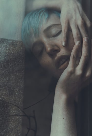 a woman with blue hair, close eyes, seen throught a window
