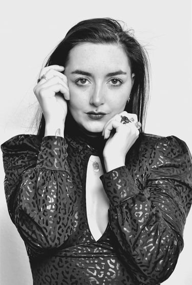 a woman in a black dress with a white background