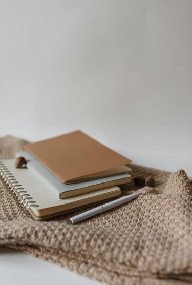 a notebook with a notebook and pen and a notebook