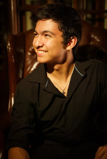 smiling portrait of a young teenage male singer and performer based in Las Vegas