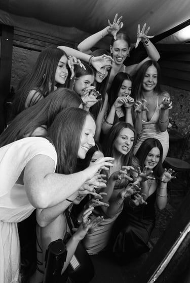 black and white image with women taking a self photograph