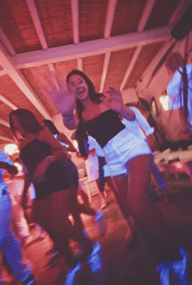 People dancing at a beach party