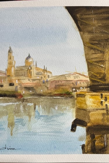 a painting of the Salamanca University seeing from the bridge