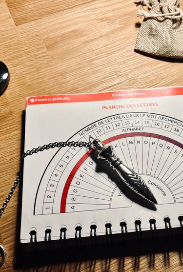 a pendulum and a pendulum sharpe sharpener on a table