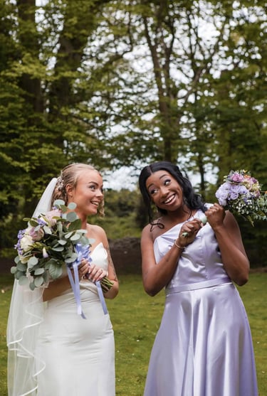 bride photographed with her maid of honour on her wedding day