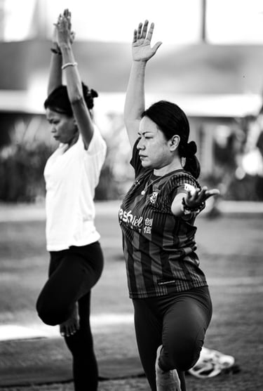 Students practice the Tree Pose in a yoga class in Langkawi