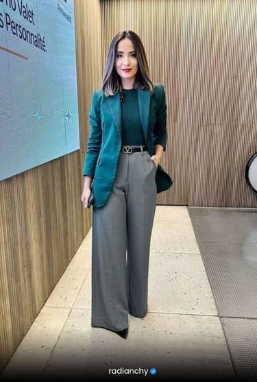 a woman in a green jacket and pants