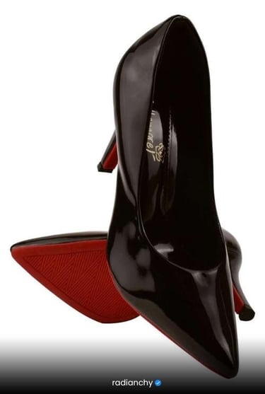 a pair of shoes with a red bottom and black bottom
