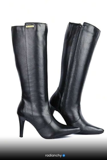 a pair of black leather boots with a high heel