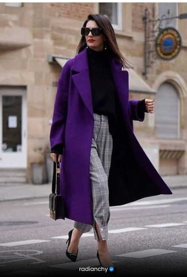 a woman in a purple coat and black heels